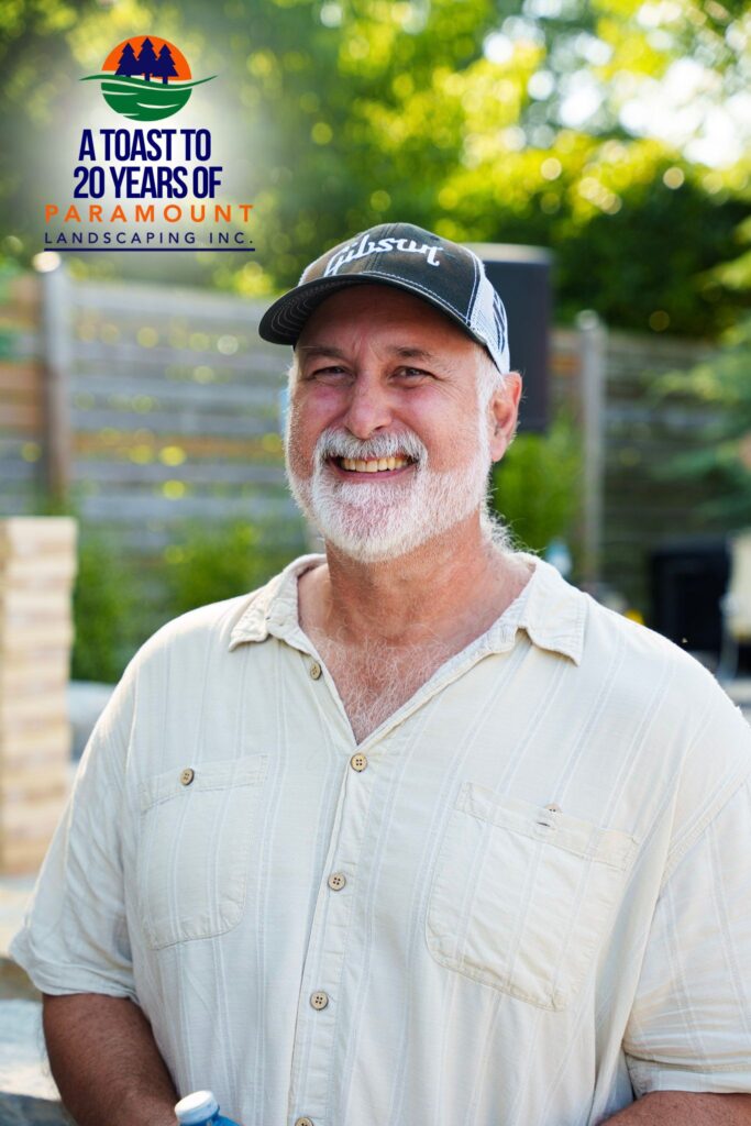 Captured during Paramount Landscaping's 20th Anniversary celebration, this candid moment features Chief Strategy Officer Melissa Rolston in conversation with Barrington Miller of Alliance Advisors and a member of Del Property Management. The image reflects the warm networking environment and strategic partnerships fostered at the event.