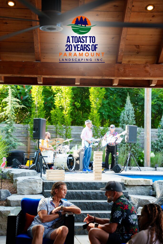 A wide shot of Paramount Landscaping’s 20th Anniversary event showing guests relaxing in the lounge area with the live band performing in the background.