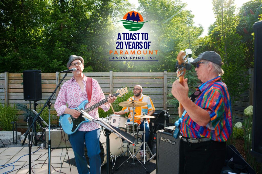Live band performing at Paramount Landscaping’s 20th Anniversary celebration under a sunny outdoor setting.
