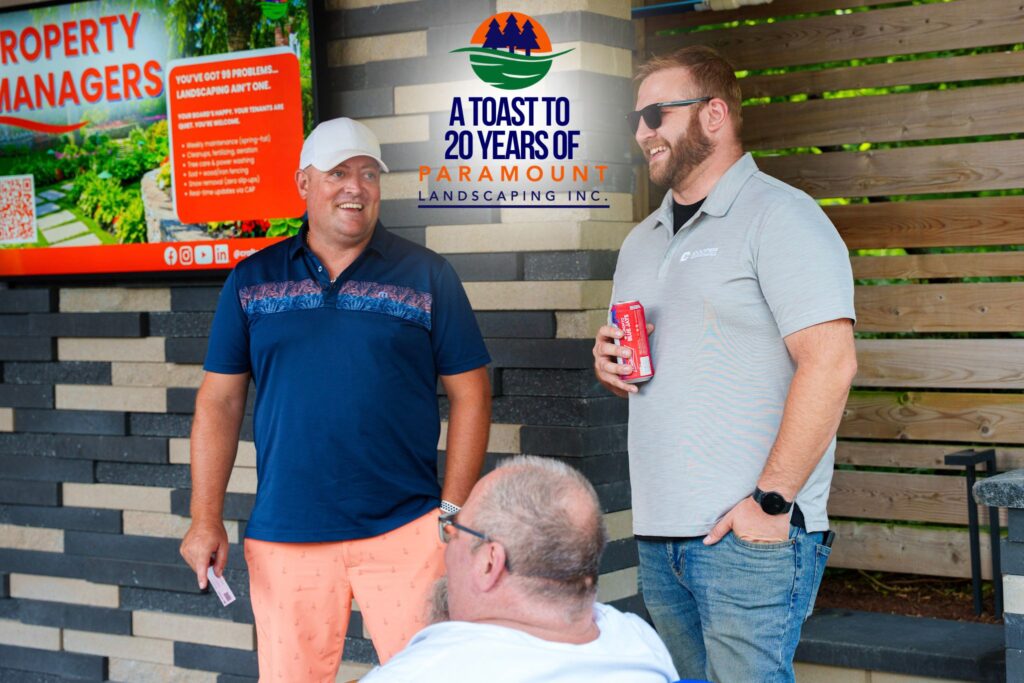 Chris Pethick and Dave Brejak from Paramount Landscaping chat with a Cooper Equipment team member at the 20th Anniversary event.