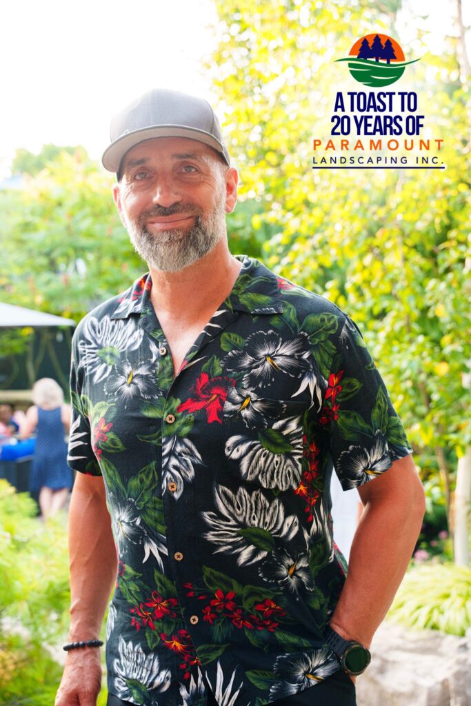 Guest standing in the pool area during Paramount Landscaping’s 20th Anniversary Celebration.