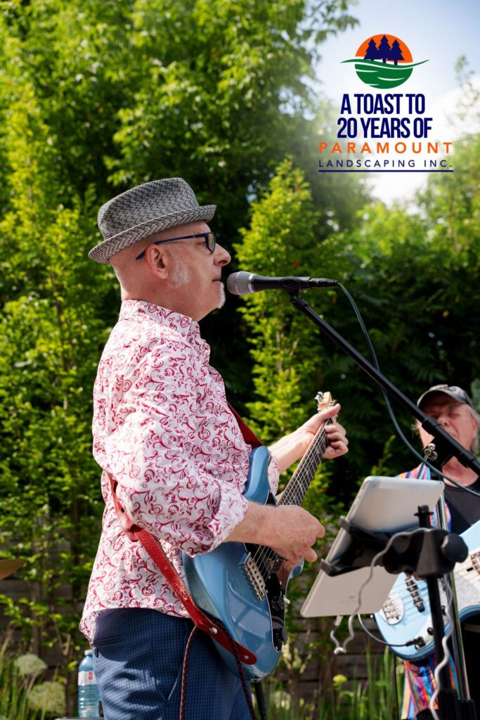 Lead singer of the live band performing at Paramount Landscaping’s 20th Anniversary Celebration near the Discovery Lounge.