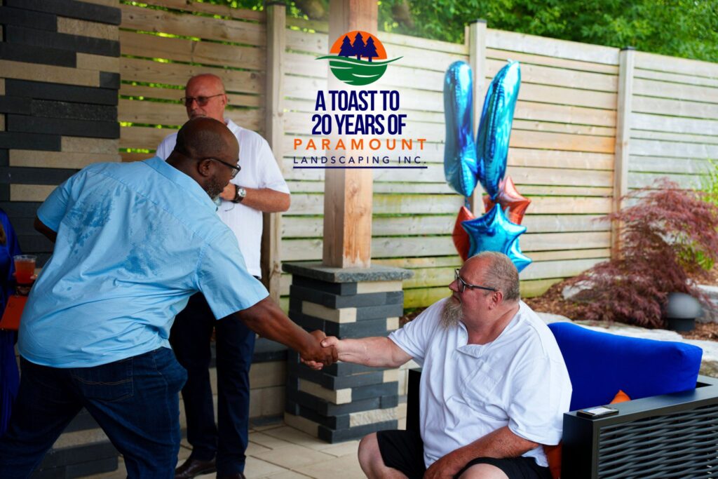 Barrington Miller chats with Dave Brejak at the Paramount Landscaping 20th Anniversary event.