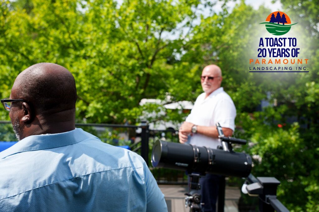 Jamie Ward giving Barrington Miller a tour of the Discovery Lounge from the rooftop “Crow’s Nest” during Paramount Landscaping’s 20th Anniversary Celebration.