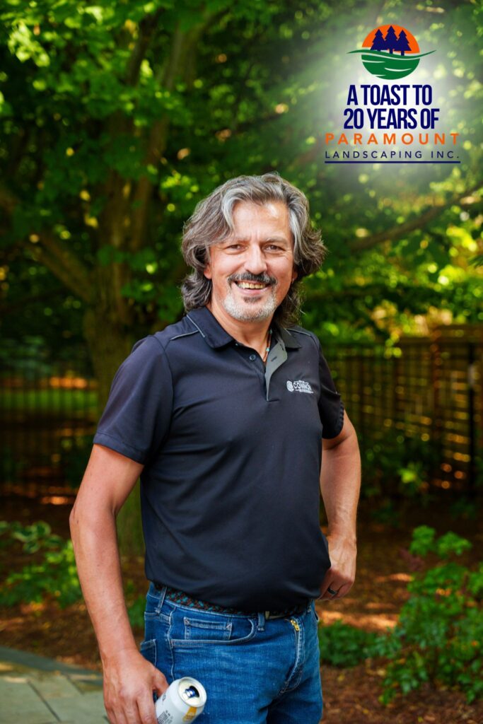 A guest stops to explore the Matt & Steve’s Caesar-themed giveaway during Paramount Landscaping’s 20th Anniversary celebration. Held in a lush outdoor setting, the event included interactive brand activations and memorable experiences for all attendees.