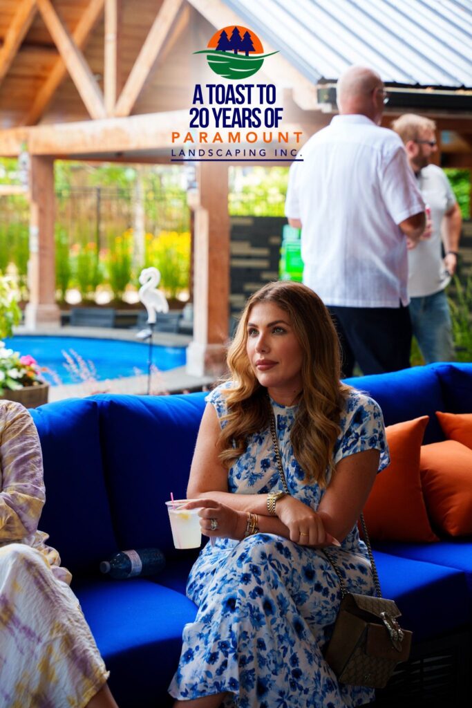 Guest from Del Property Management enjoying conversation and refreshments inside Paramount Landscaping’s Discovery Lounge during the 20th Anniversary celebration.