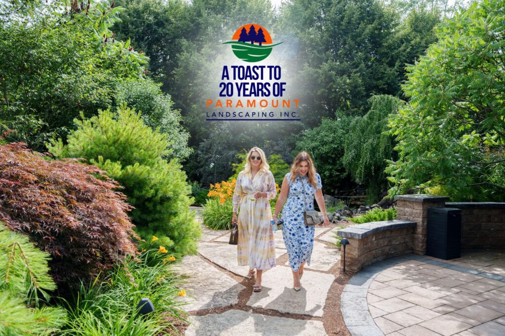 Guests from Del Property Management walking through the lush landscaping outside Paramount’s Discovery Lounge during the 20th Anniversary event.