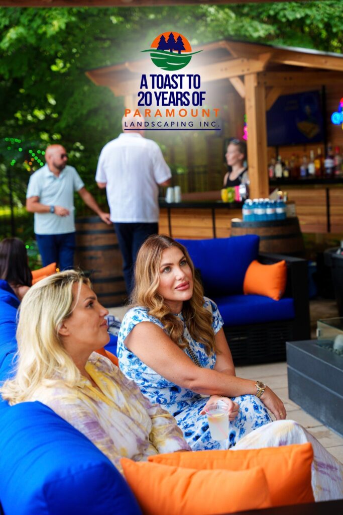 Guests from Del Property Management chatting and enjoying refreshments at Paramount Landscaping’s 20th Anniversary celebration inside the Discovery Lounge.