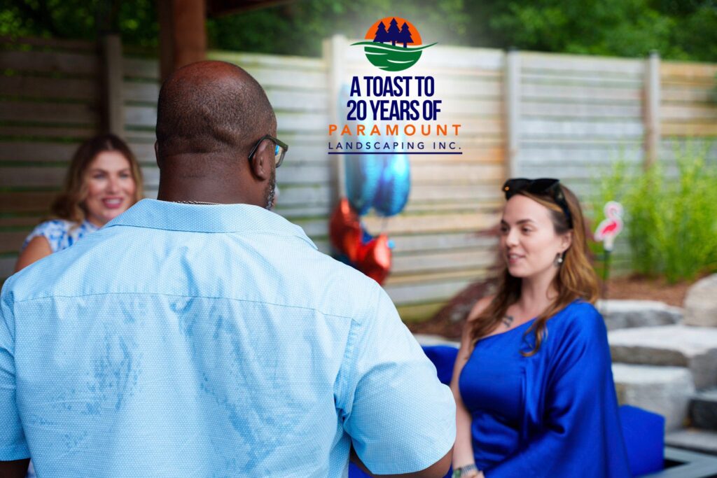 Melissa Rolston chatting with Barrington Miller of Alliance Advisors and a team member from Del Property Management during Paramount Landscaping’s 20th anniversary celebration.