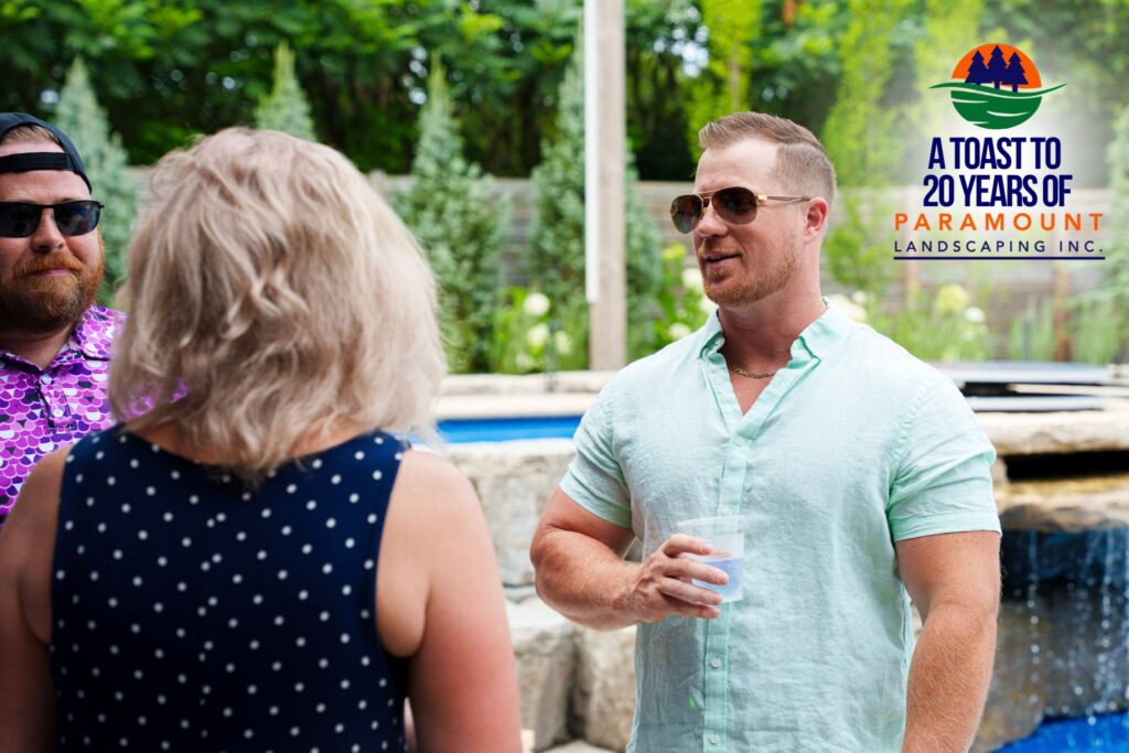Guests engaged in a lively conversation during Paramount Landscaping’s 20th Anniversary event.