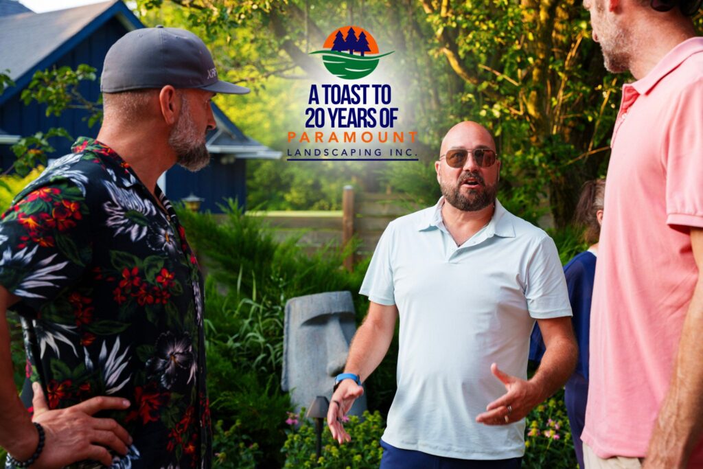 Doug Dolson, CEO of Paramount Landscaping, chats with Tim Cooper, Senior Account Manager at Miska Trailers, and a guest during the 20th Anniversary celebration.