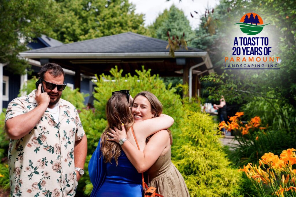 Melissa Rolston warmly hugging Sarah, wife of Vito Peragine from Halton Pool Guys, upon their arrival at Paramount Landscaping’s 20th Anniversary Celebration.