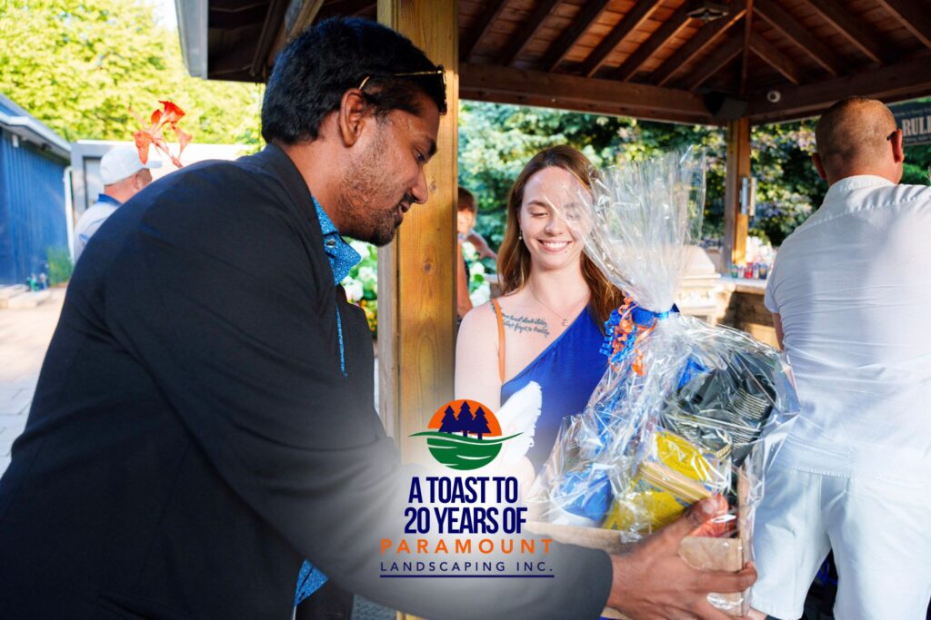 Melissa Rolston presenting the Rise & Shine Kit to Arshaad Mustafa during Paramount Landscaping’s 20th Anniversary Celebration in the Discovery Lounge.