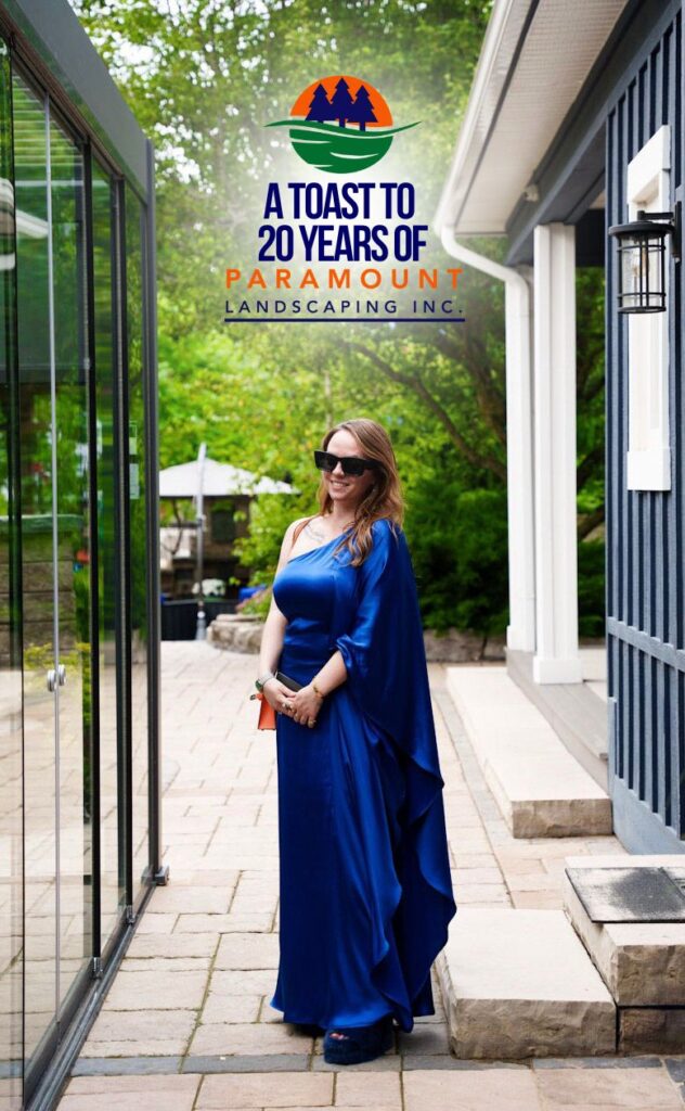 Melissa Rolston standing in Paramount Landscaping’s Discovery Lounge beside the hot tub and contemporary pergola installation.
