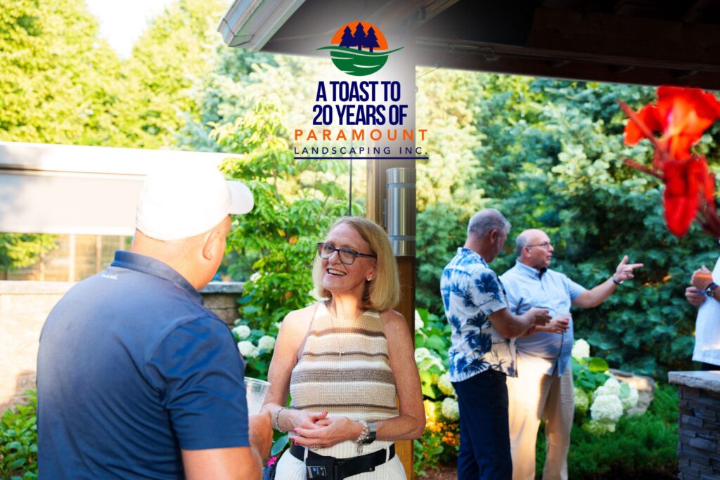 Peggi Shepherd DeGroote interacting with guests near the welcome area at Paramount’s 20th Anniversary.
