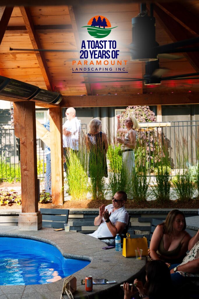 Team members from Pool Guys and Zoran Properties enjoying the sunken bar area by the pool at Paramount Landscaping’s 20th Anniversary celebration.