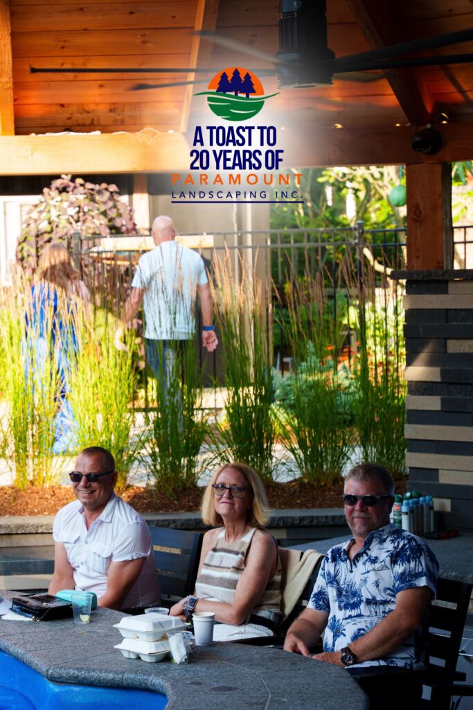 Peggi Shepherd-DeGroote, a notable figure in the healthcare industry, seated beside her husband Michael and Lou from Zoran Properties during the Paramount Landscaping 20th Anniversary event.